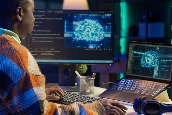 black-man-programmer-manages-code-scripts-artificial-intelligence_482257-109919